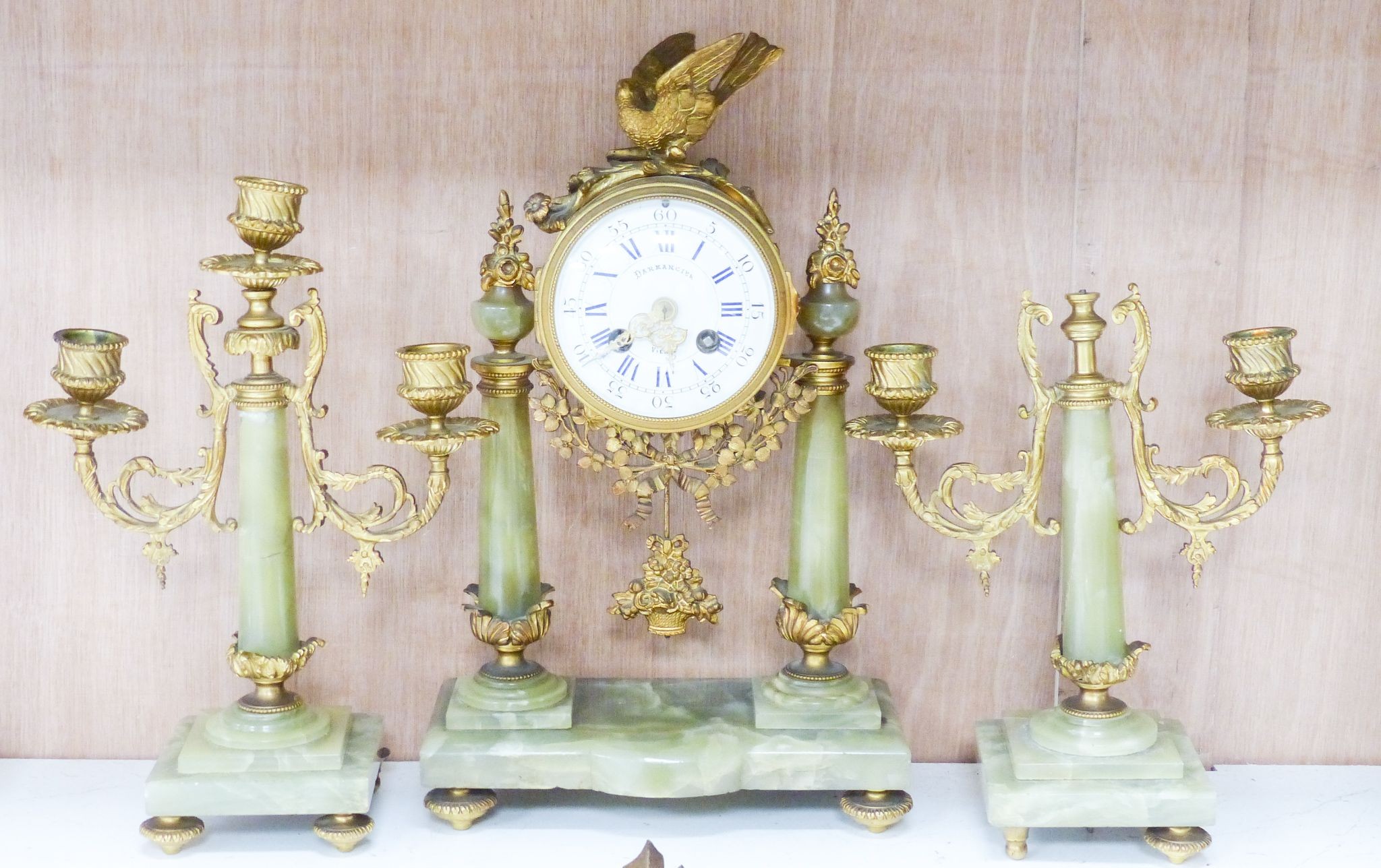 An ormolu and green onyx clock garniture